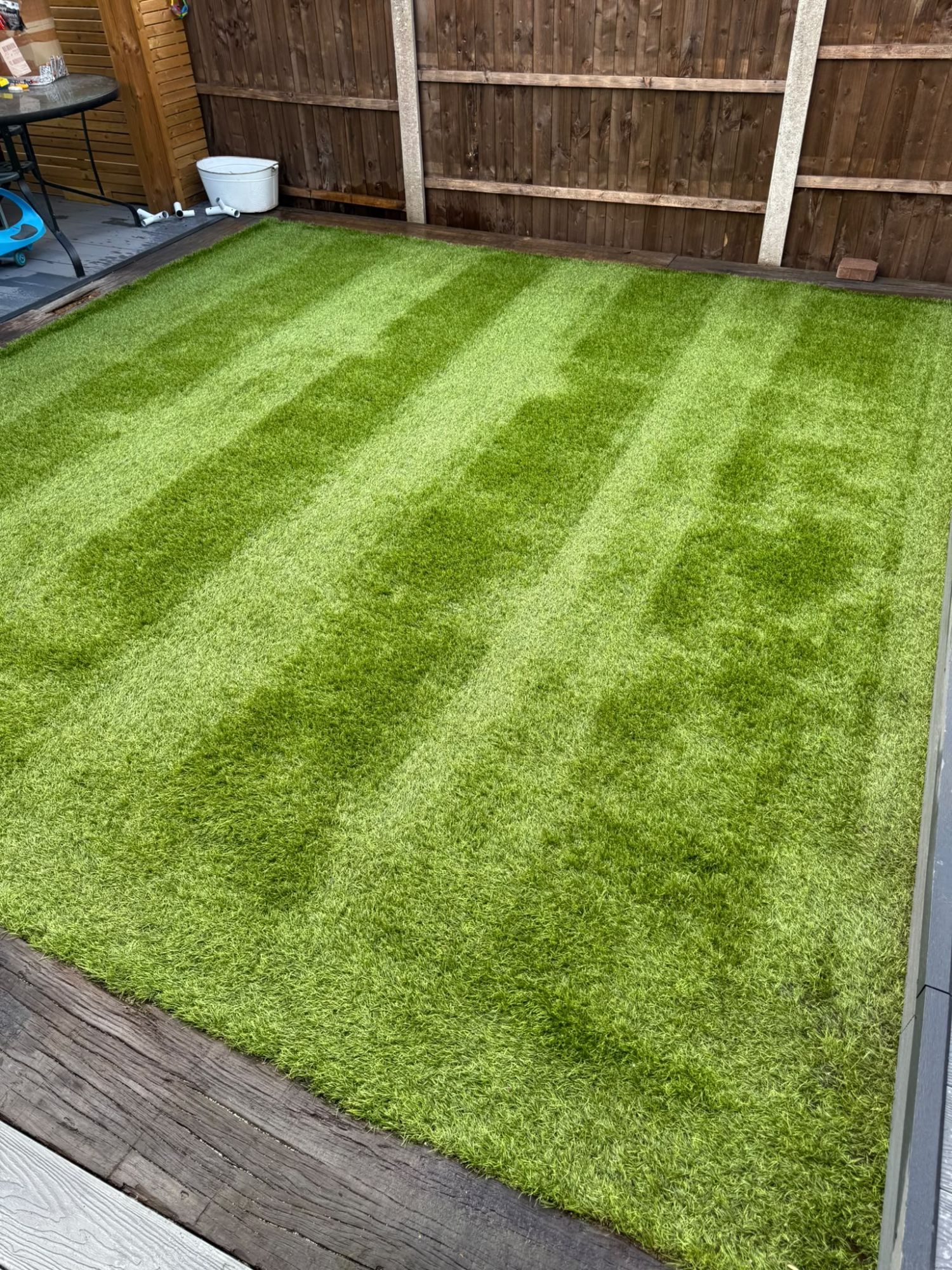 Artificial grass with sharp Astro VAX lines after enzyme cleaning and power brushing