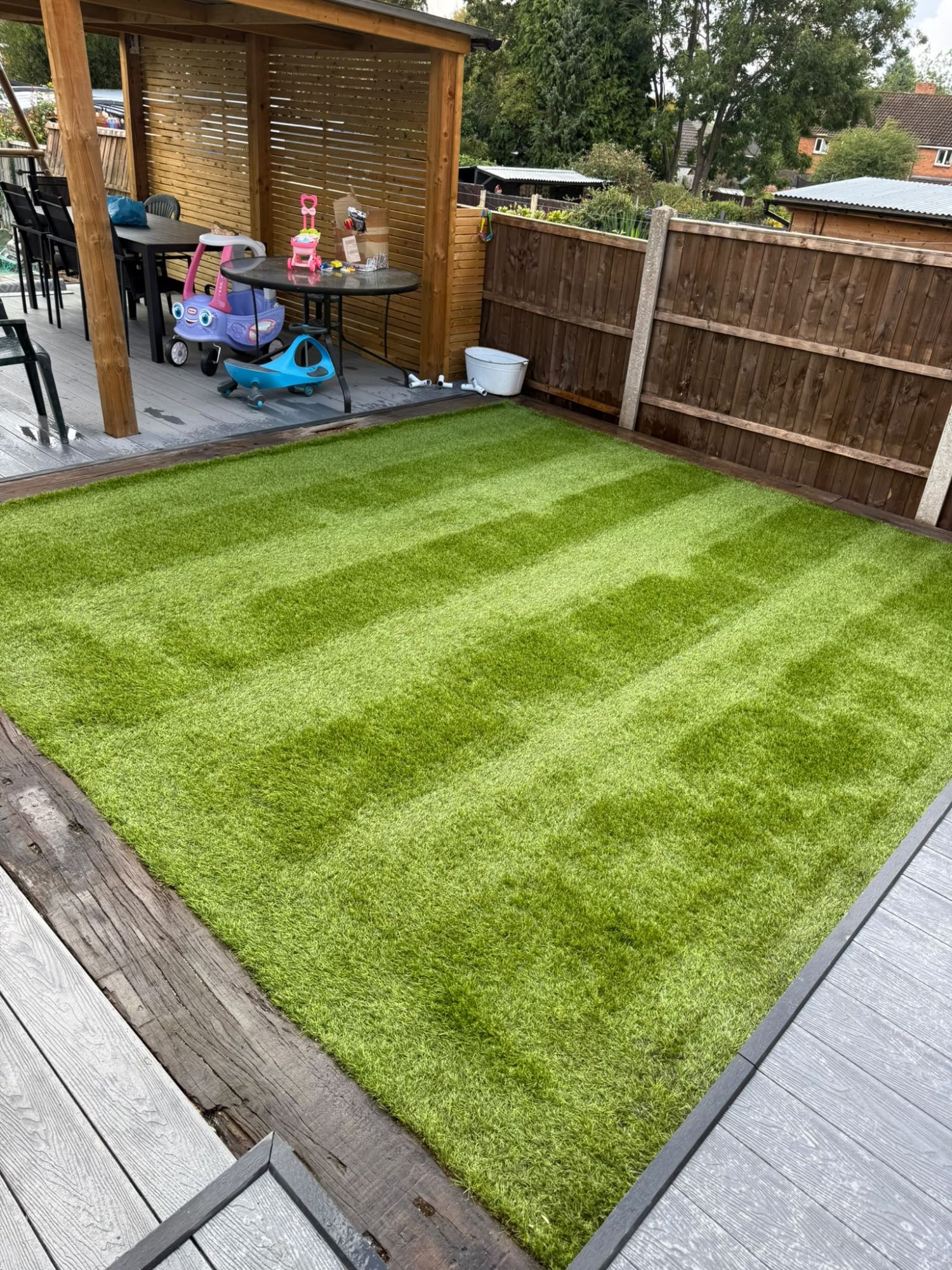 Clean, odour-free artificial lawn viewed from above after a pet urine deep clean