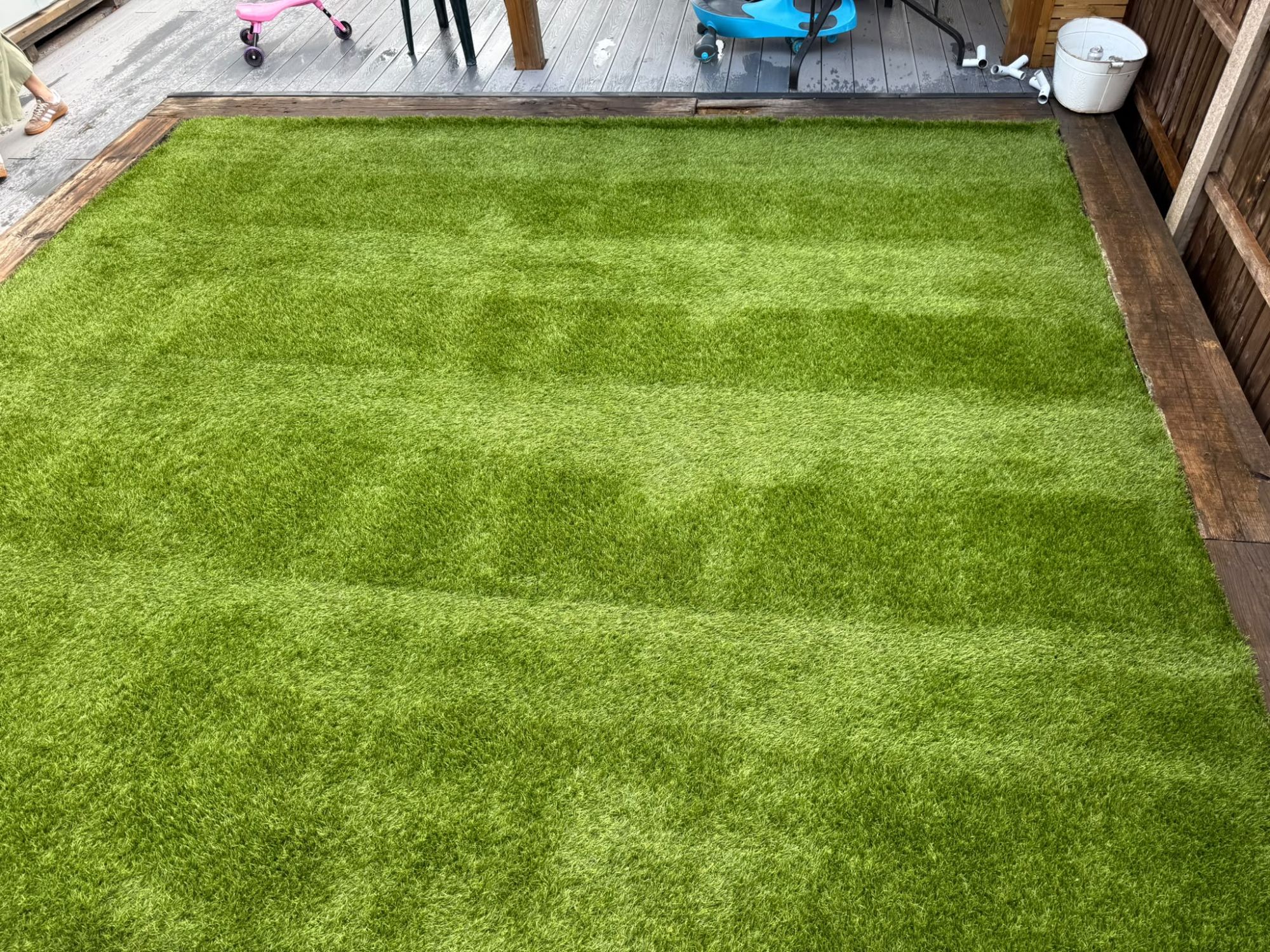 Close-up of the lifted, refreshed artificial grass pile after power brushing