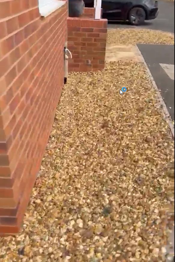 The same gravel area cleared and tidied to a clean, even finish